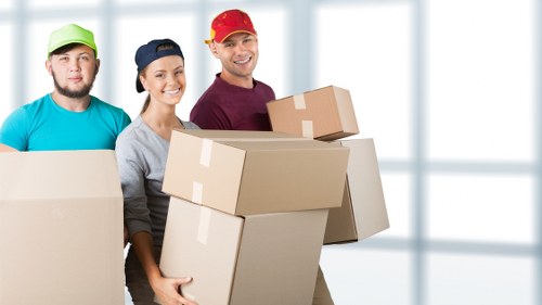 Packed office boxes and equipment ready for transport during a local move