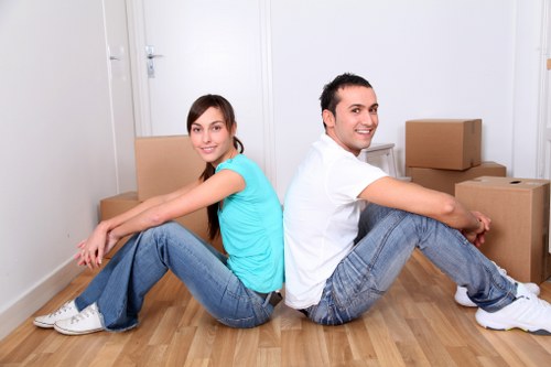 Packed moving boxes and furniture ready for transport in a local home move